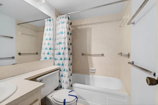 a view of a balcony with floor to ceiling windows with yard