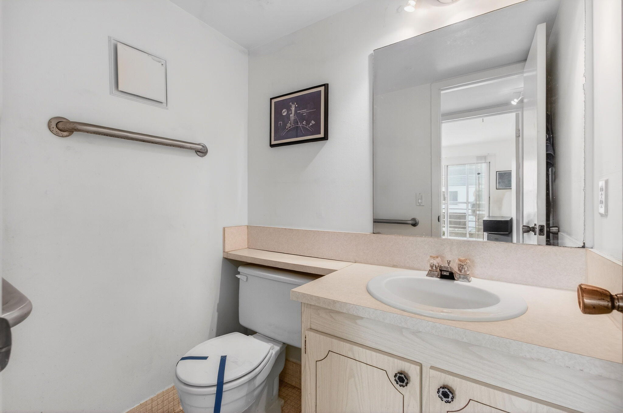 321 Fanshaw H Boca Raton, FL 33434 - Photo 33 of 92 a bathroom with a sink toilet and a mirror