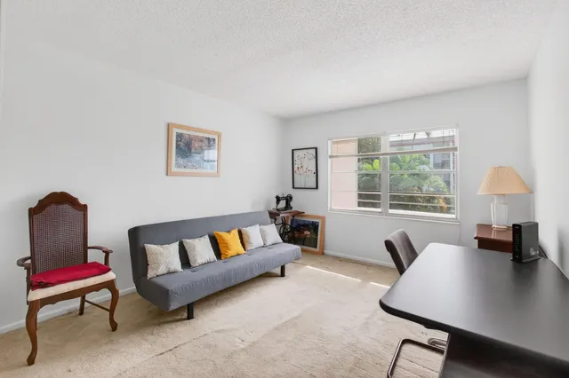 a view of a lake with houses in the back