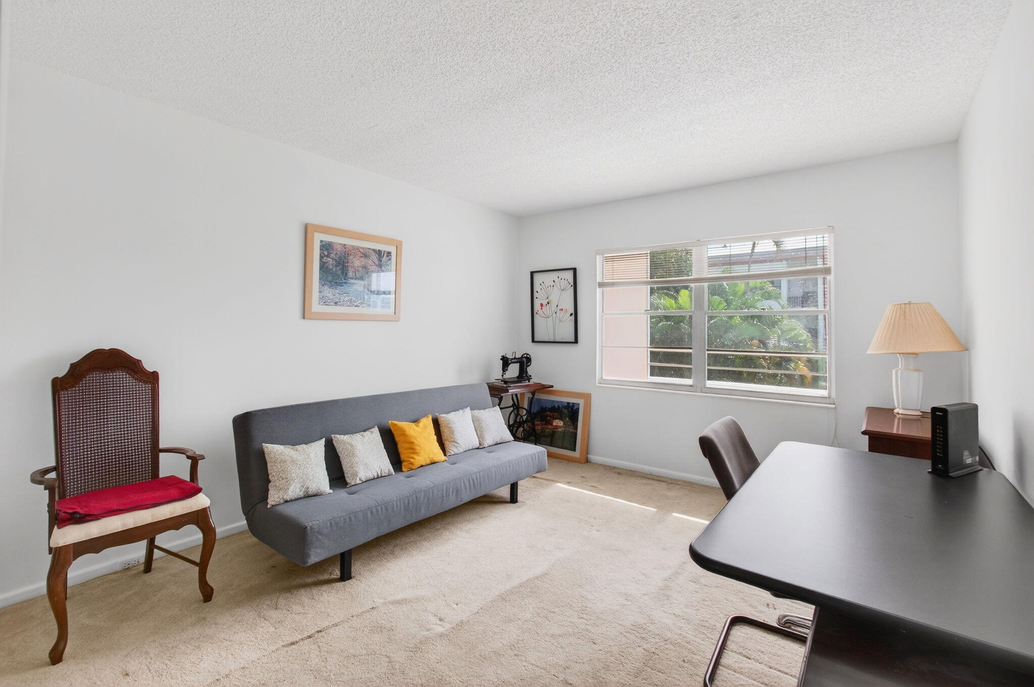 321 Fanshaw H Boca Raton, FL 33434 - Photo 35 of 92 a living room with furniture and a window