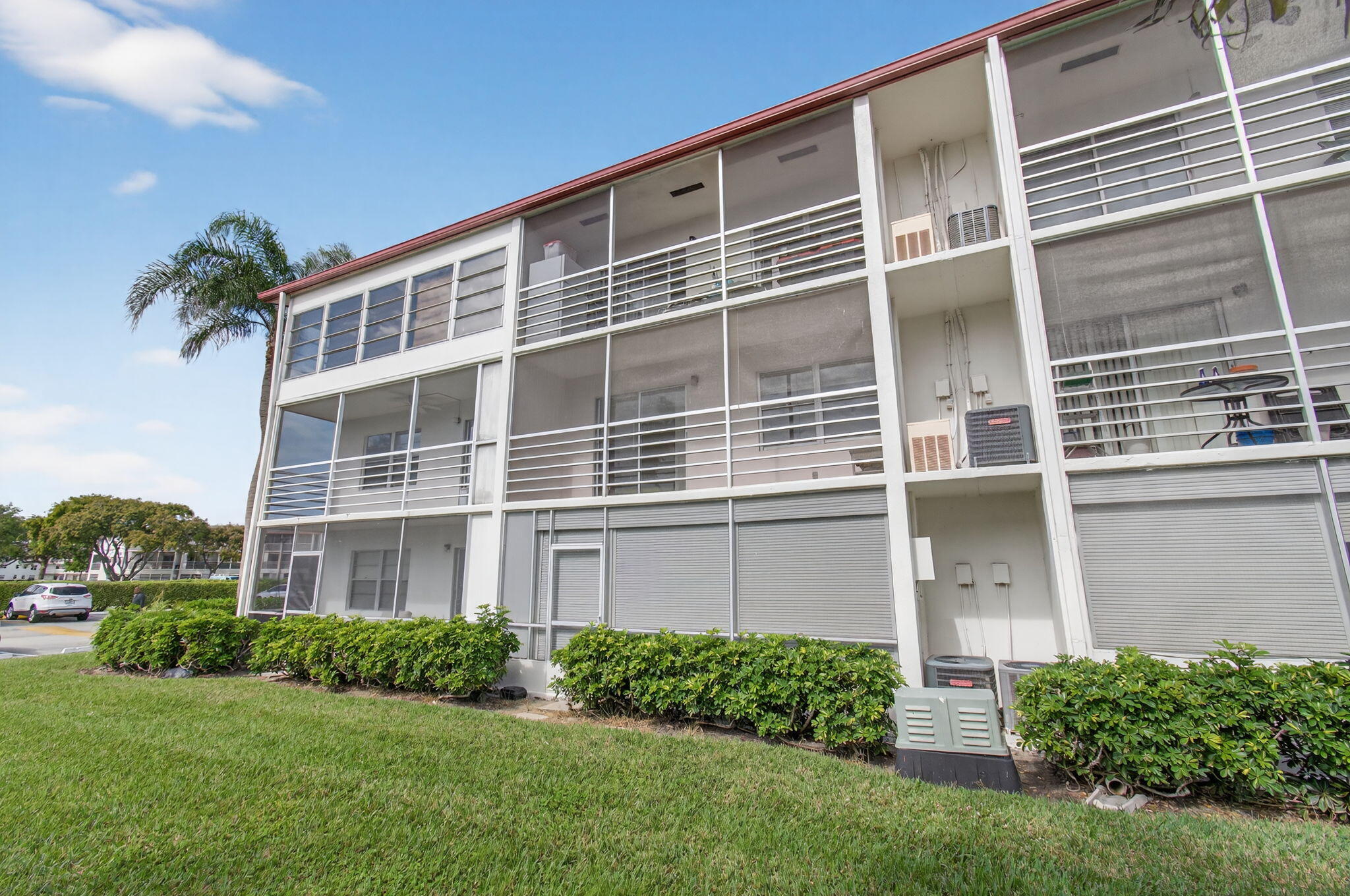 321 Fanshaw H Boca Raton, FL 33434 - Photo 46 of 92 a front view of a house with a yard