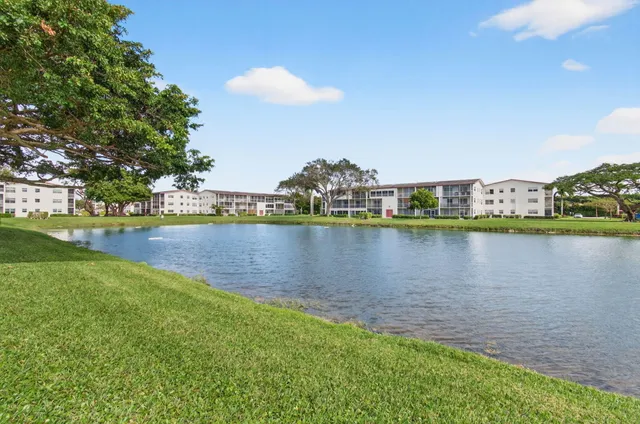 an aerial view of a house with garden space and street view
