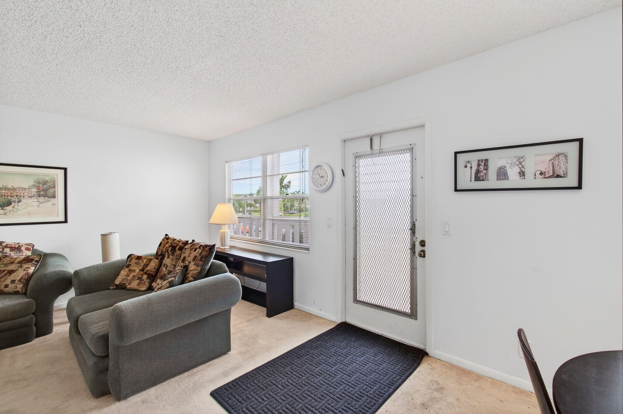 321 Fanshaw H Boca Raton, FL 33434 - Photo 7 of 92 a living room with furniture and a window