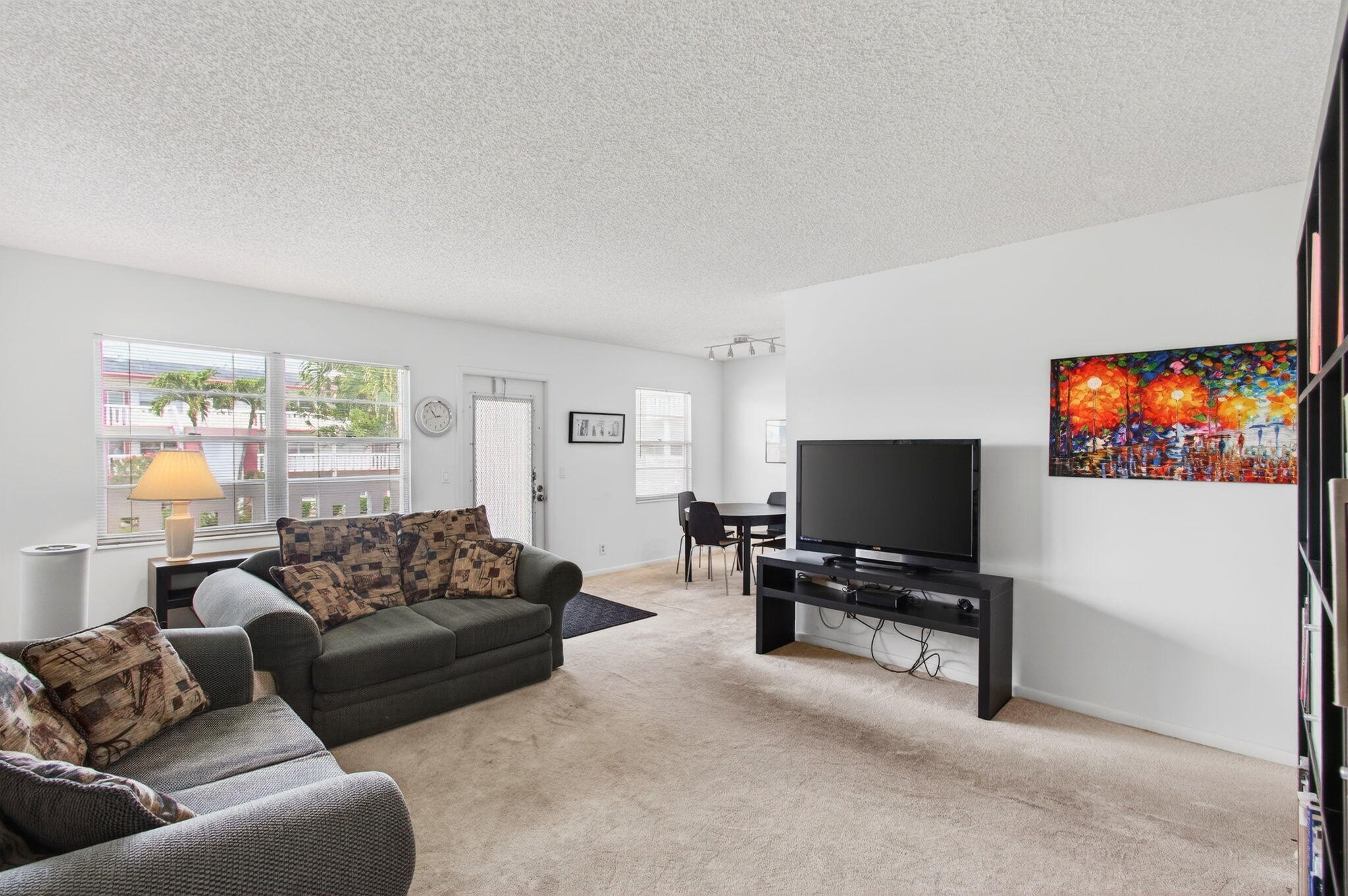 321 Fanshaw H Boca Raton, FL 33434 - Photo 10 of 92 a living room with furniture and a flat screen tv