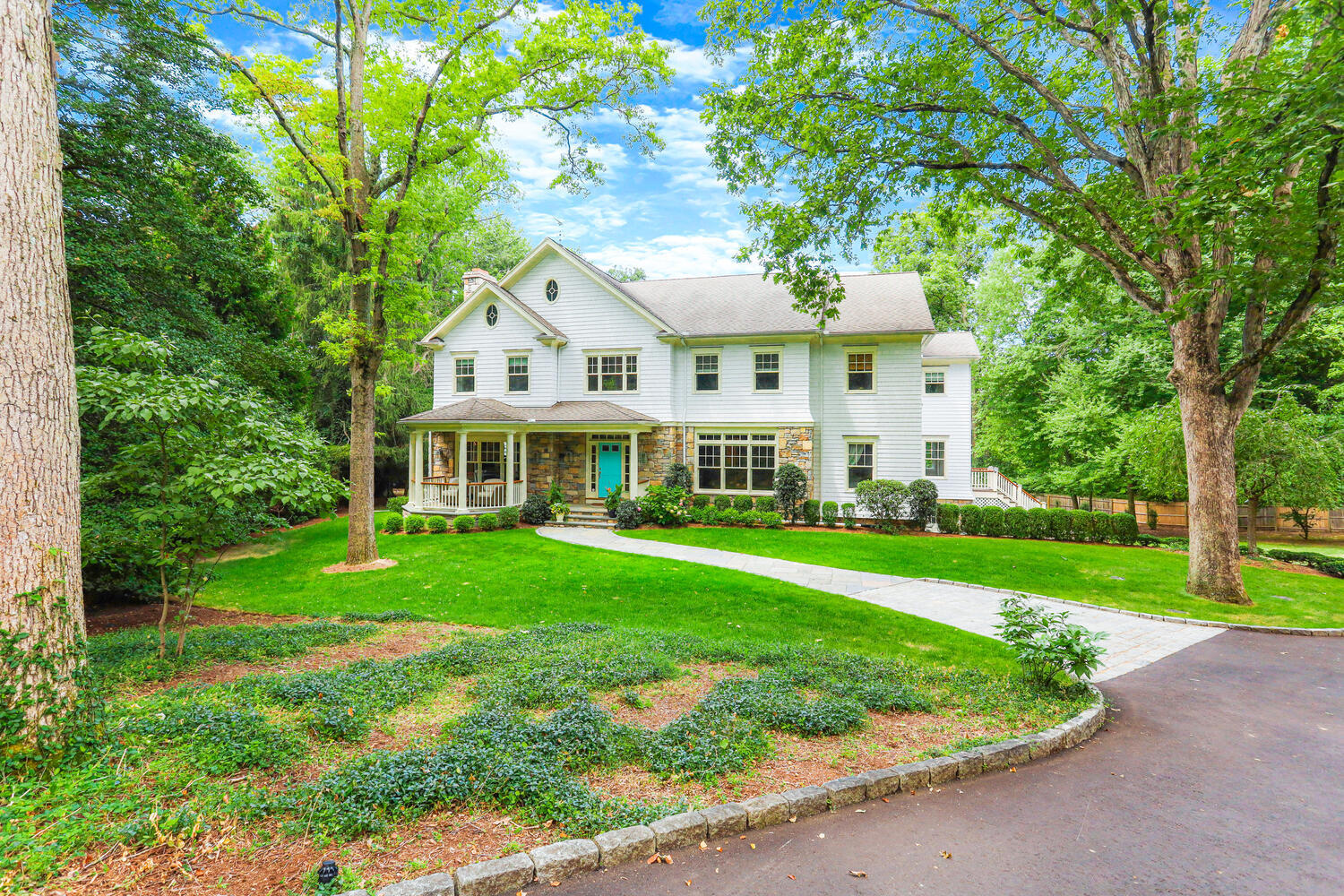 a front view of a house with a yard table and chairs
