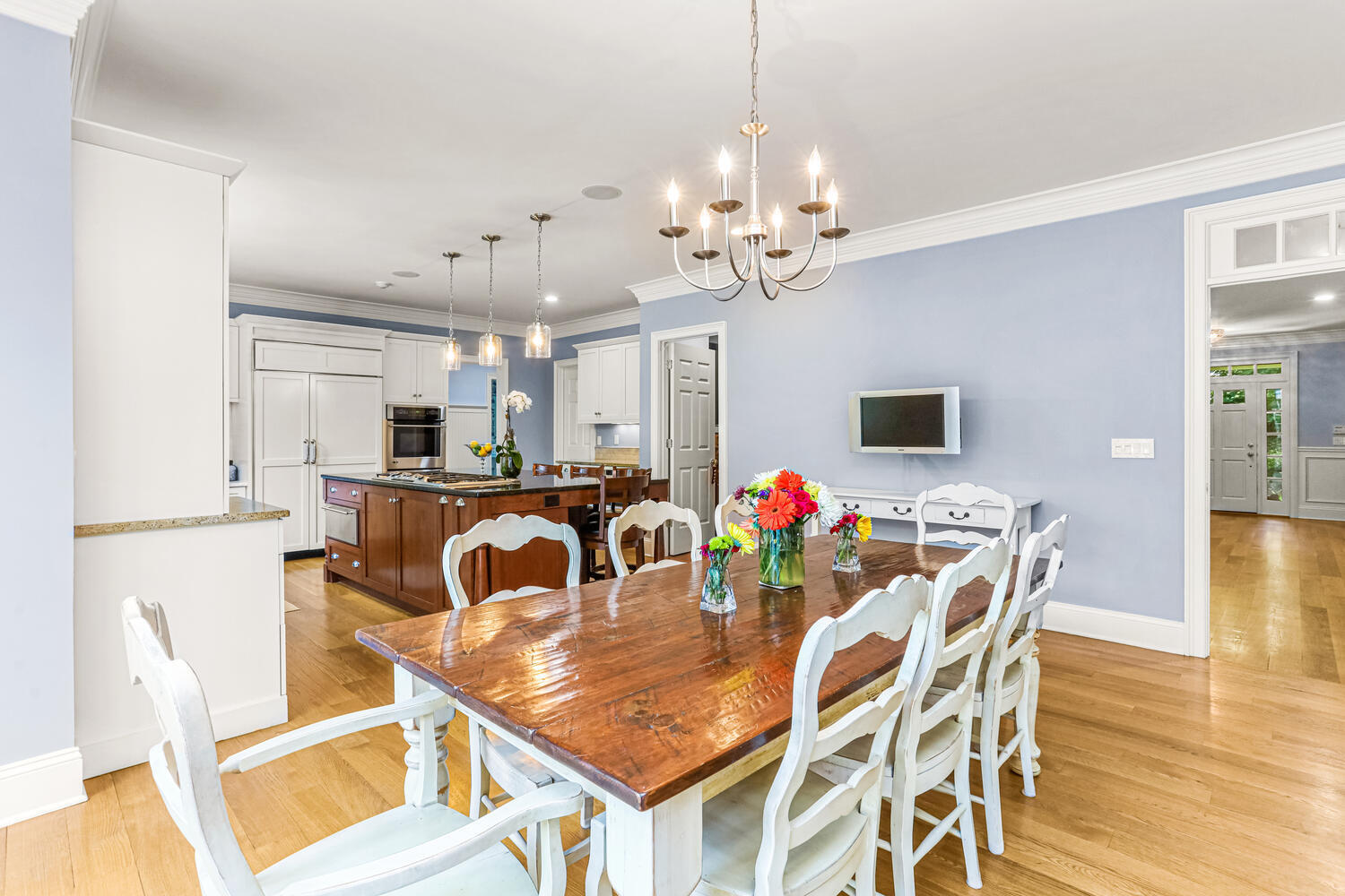29 Old Oak Road Darien, CT 06820 - Photo 11 of 31 a view of a dining room and livingroom with furniture wooden floor a chandelier