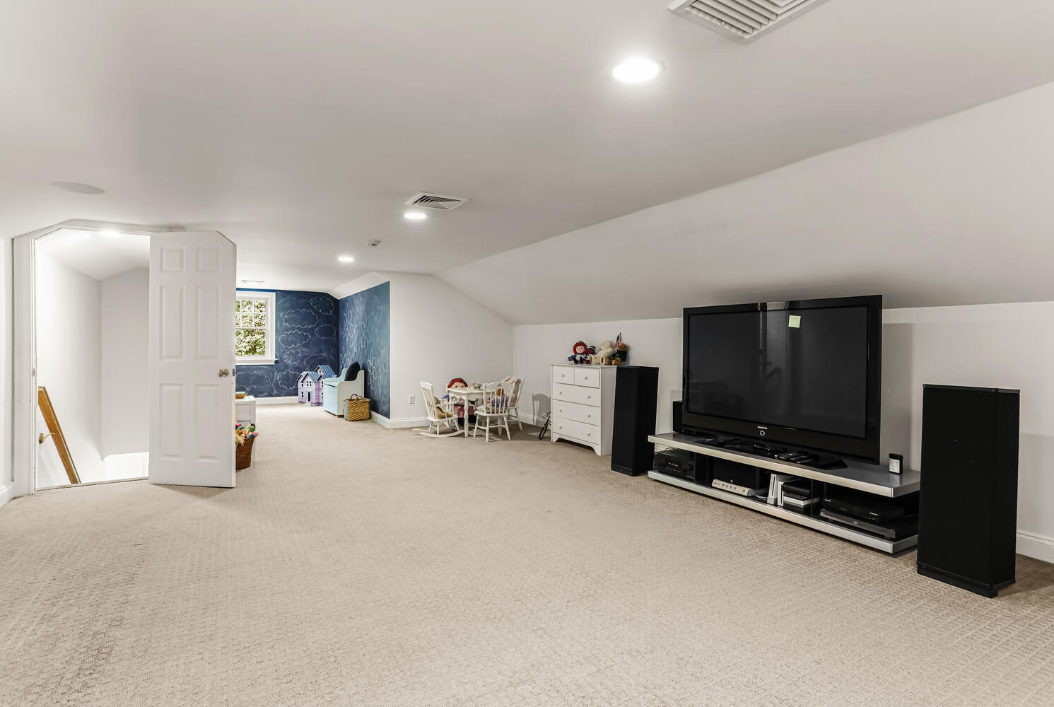 29 Old Oak Road Darien, CT 06820 - Photo 25 of 31 a view of a room with gym equipment and a flat screen tv