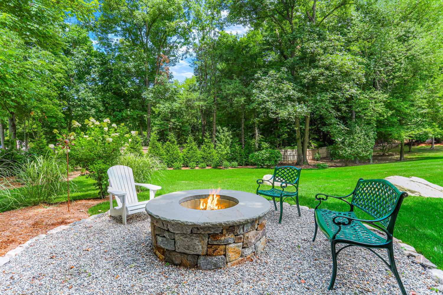 29 Old Oak Road Darien, CT 06820 - Photo 29 of 31 a view of a table and chairs in backyard