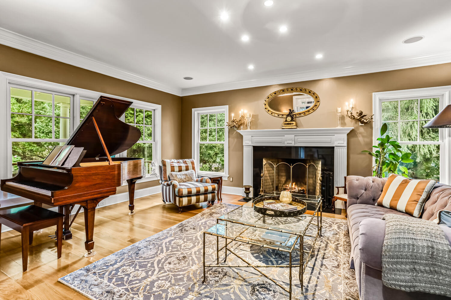 29 Old Oak Road Darien, CT 06820 - Photo 4 of 31 a living room with furniture a fireplace and a large window