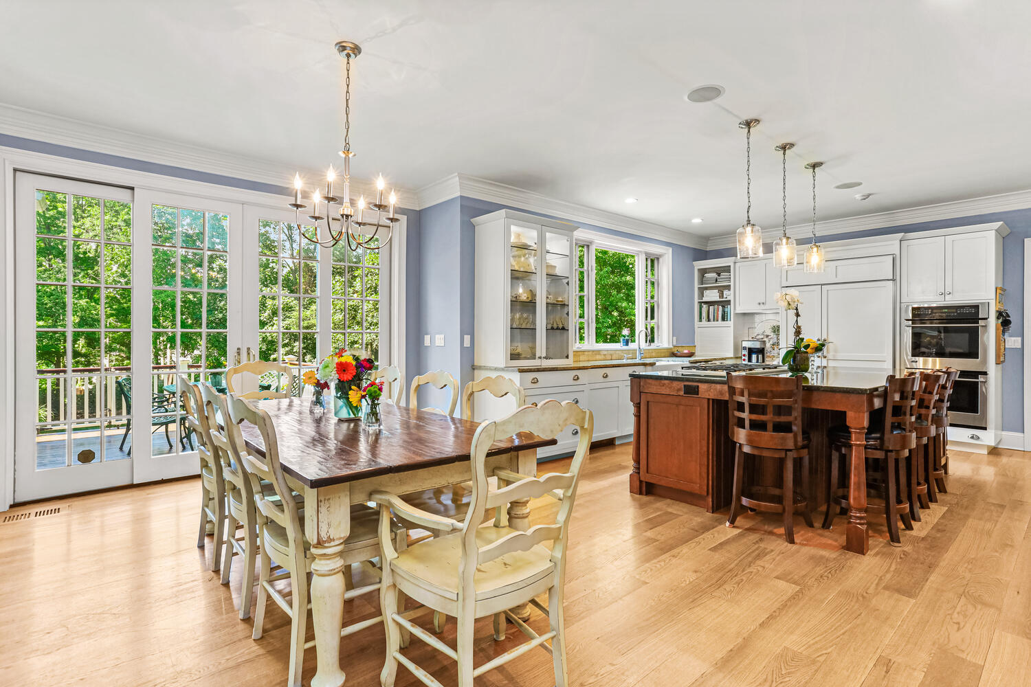 29 Old Oak Road Darien, CT 06820 - Photo 9 of 31 a view of a dining room and livingroom with furniture wooden floor a chandelier