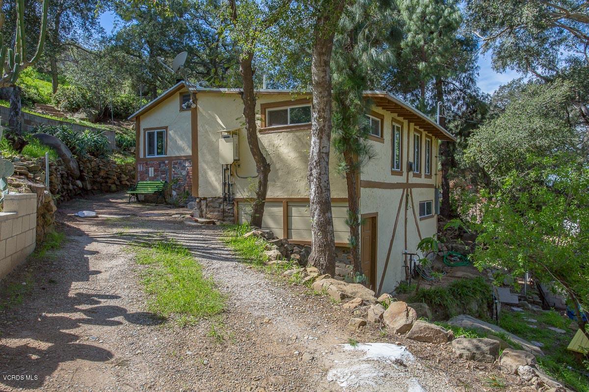 7748 Lilac Lane Simi Valley, CA 93063 - Photo 3 of 18 a front view of a house with garden