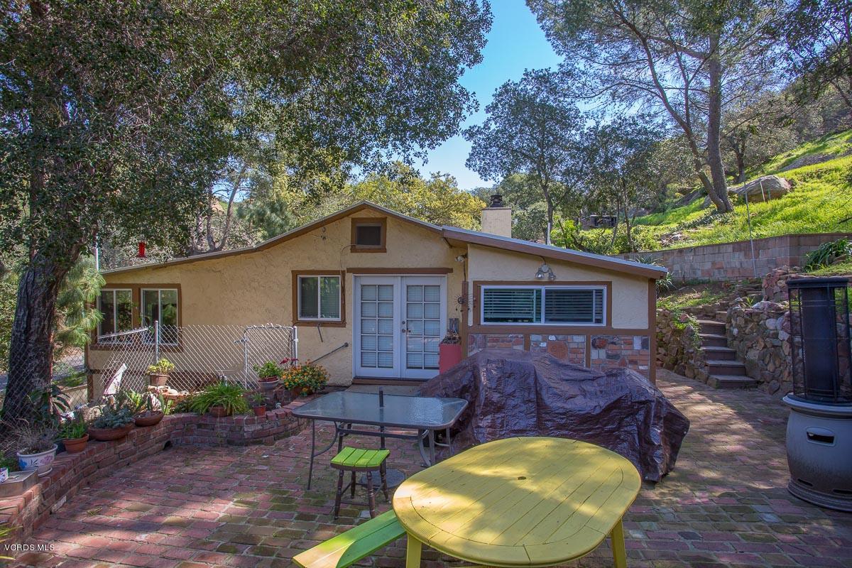 7748 Lilac Lane Simi Valley, CA 93063 - Photo 4 of 18 a backyard of a house with table and chairs
