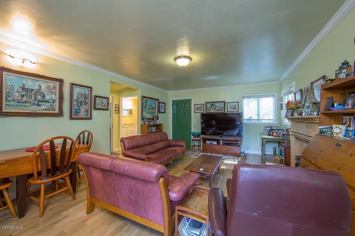 7748 Lilac Lane Simi Valley, CA 93063 - Photo 7 of 18 a living room with furniture and a flat screen tv