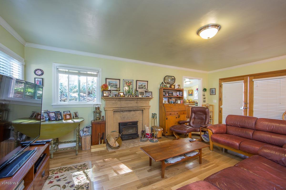 7748 Lilac Lane Simi Valley, CA 93063 - Photo 9 of 18 a living room with furniture and a fireplace