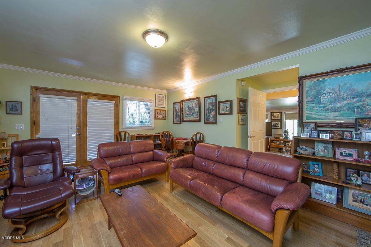 7748 Lilac Lane Simi Valley, CA 93063 - Photo 10 of 18 a living room with furniture and a book shelf