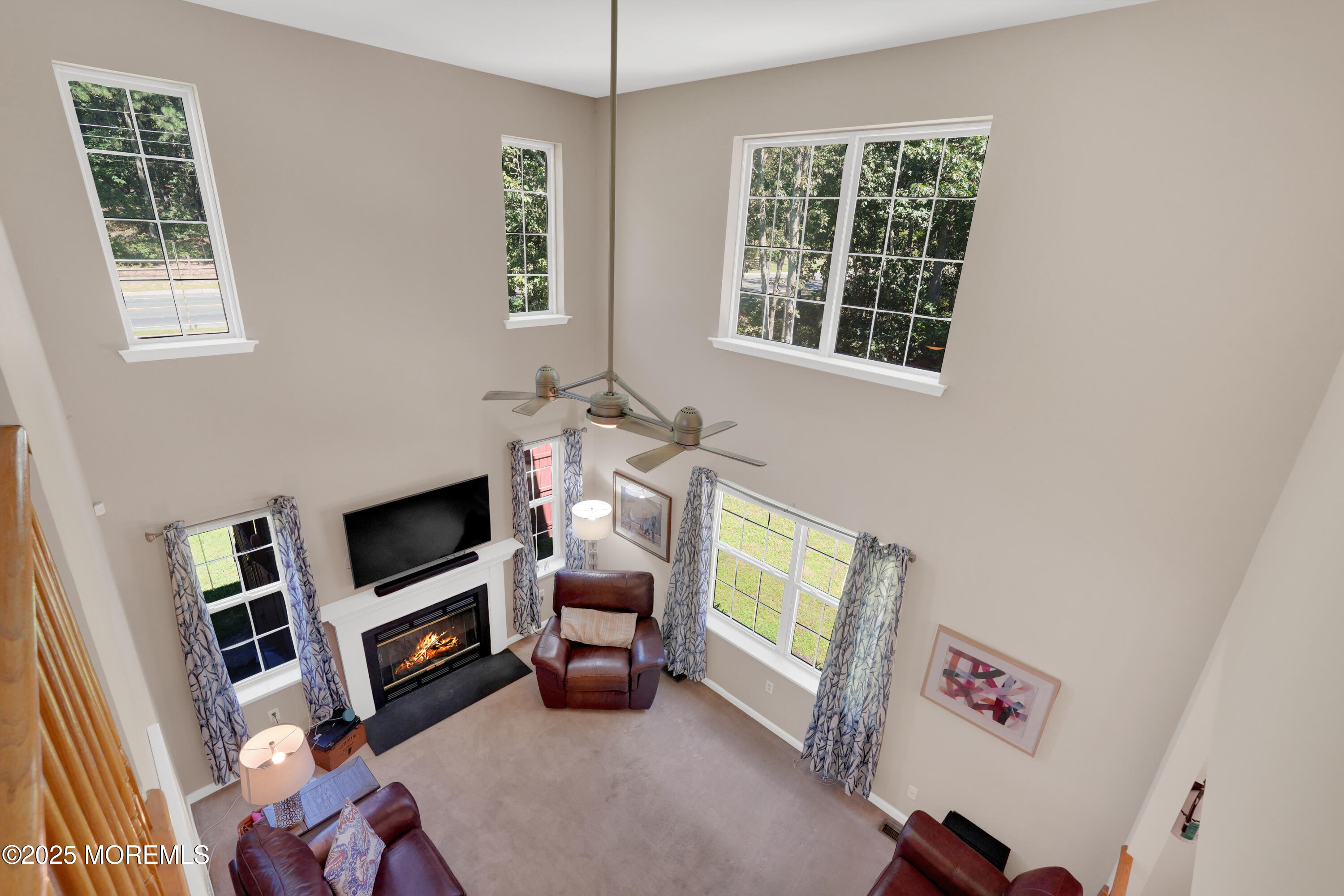 3 Diamond Lane Howell, NJ 07731 - Photo 13 of 43 a living room with furniture a flat screen tv and a window