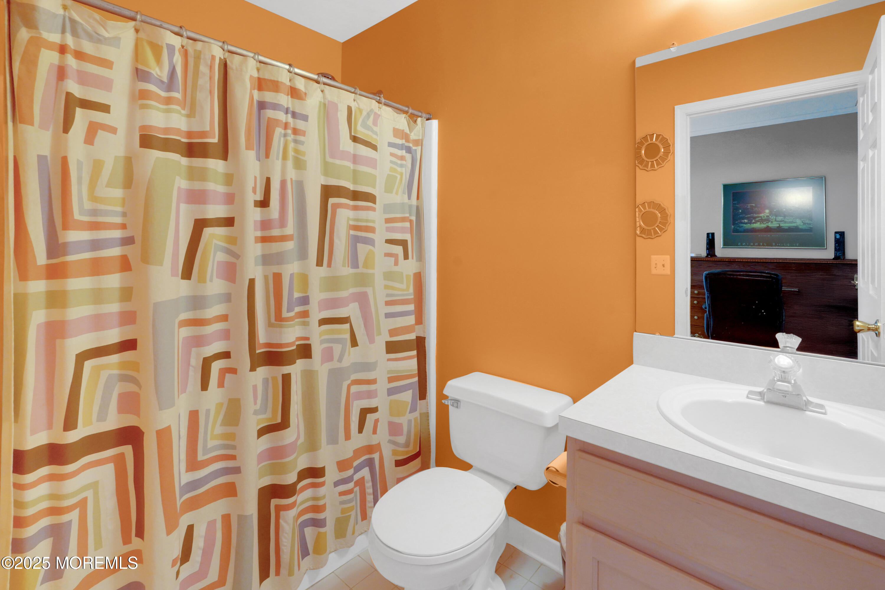 3 Diamond Lane Howell, NJ 07731 - Photo 25 of 43 a bathroom with a sink a toilet and shower curtain