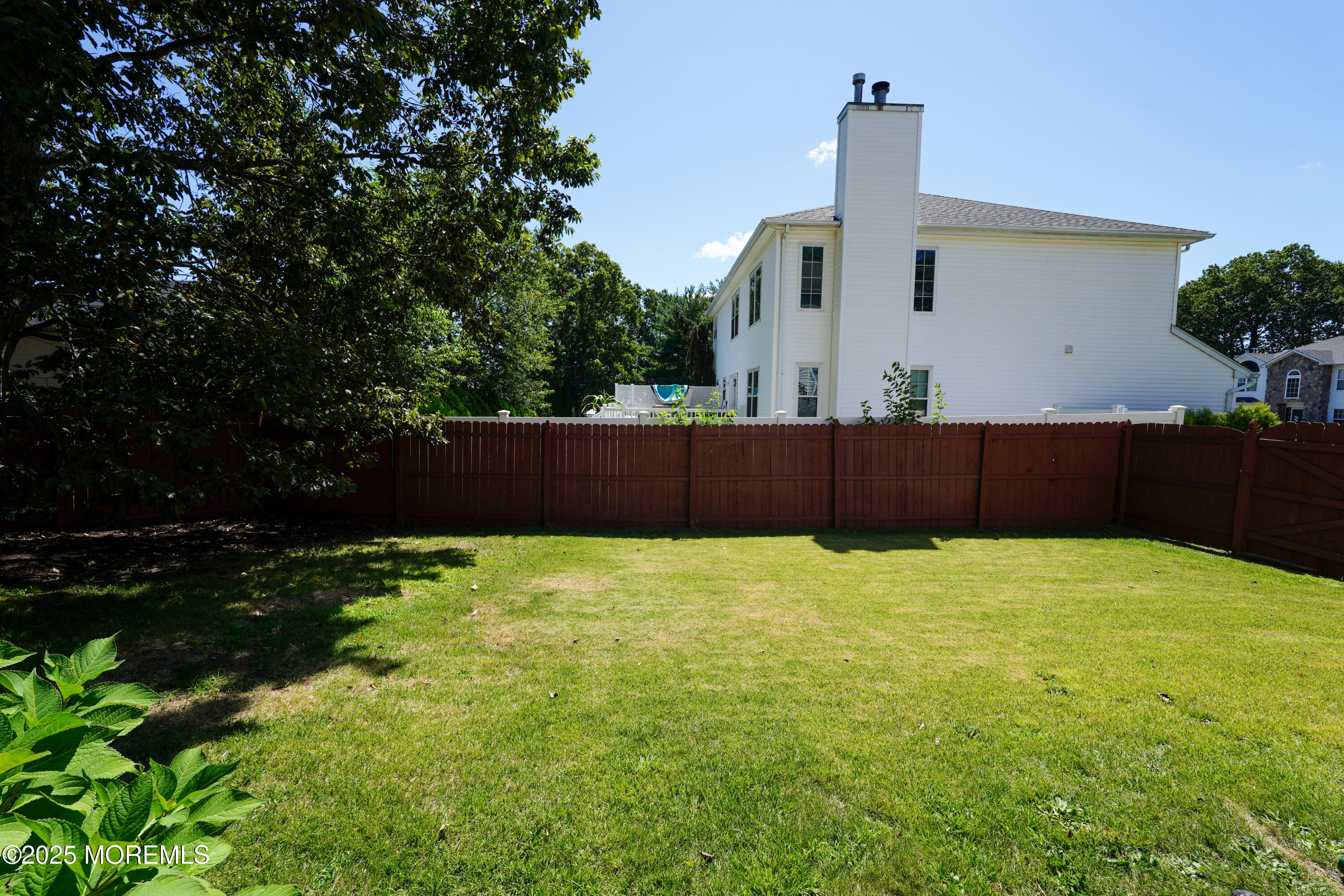 3 Diamond Lane Howell, NJ 07731 - Photo 31 of 43 a view of backyard with hardwood