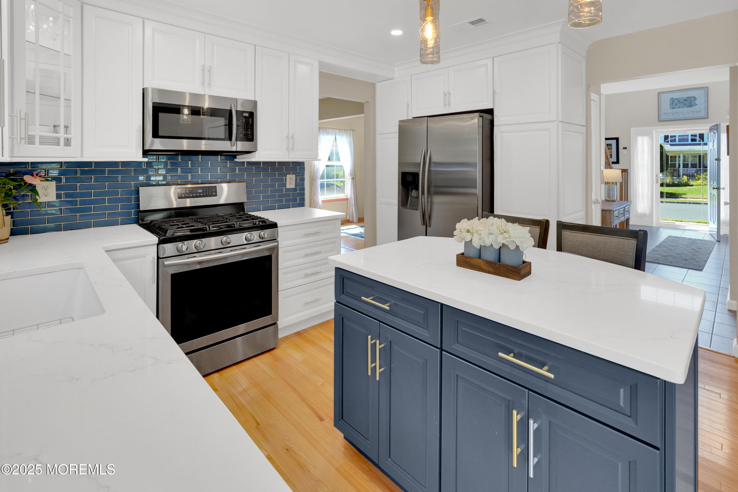 3 Diamond Lane Howell, NJ 07731 - Photo 9 of 43 a kitchen with stainless steel appliances a stove microwave and refrigerator