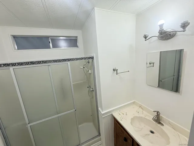 a bathroom with a sink and mirror