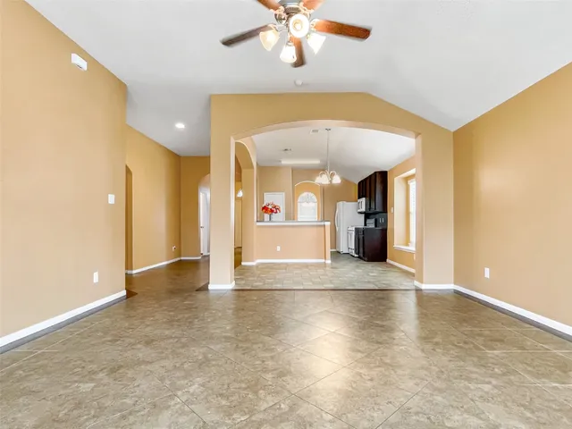 a view of a kitchen with a sink and a chandelier