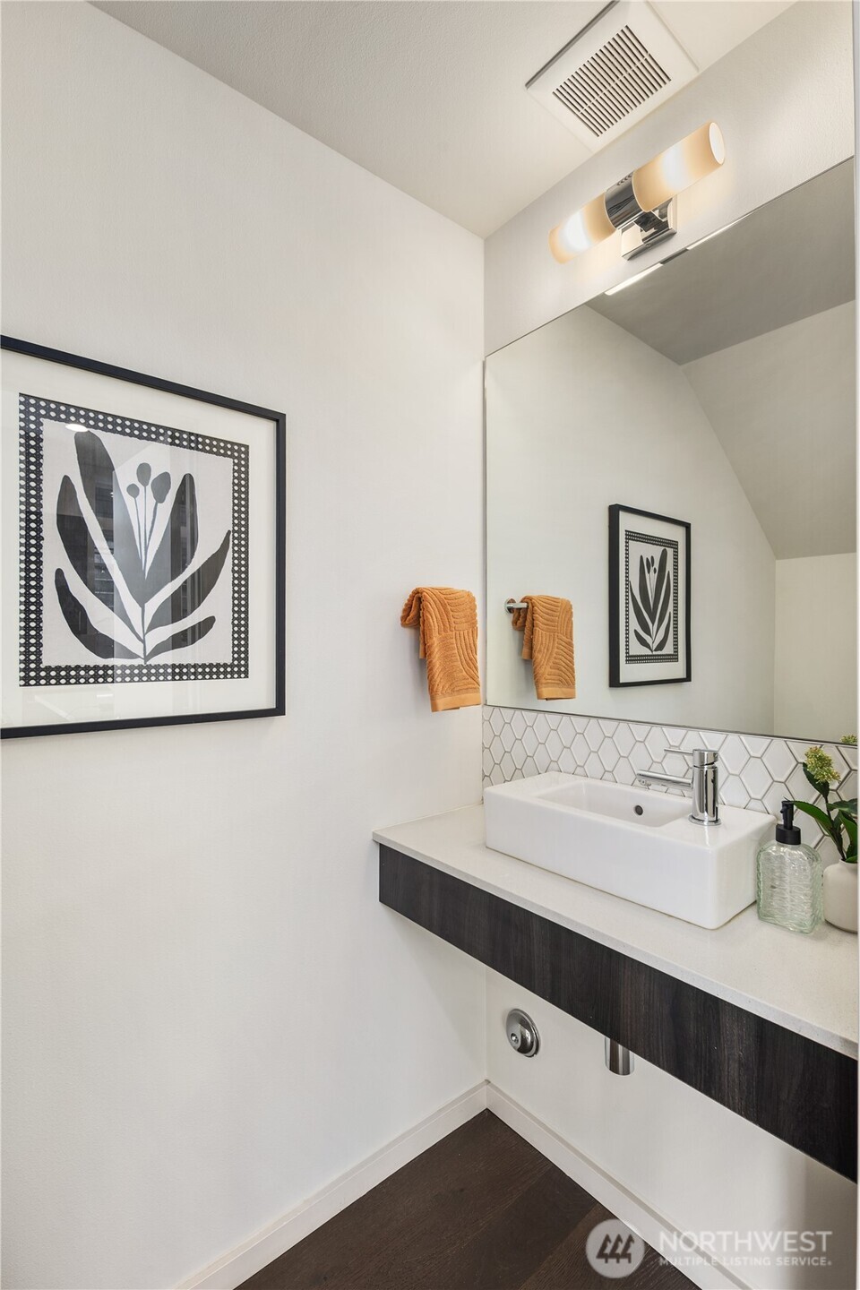 926 North 35th Street Seattle, WA 98103 - Photo 18 of 40 a bathroom with a sink and a mirror
