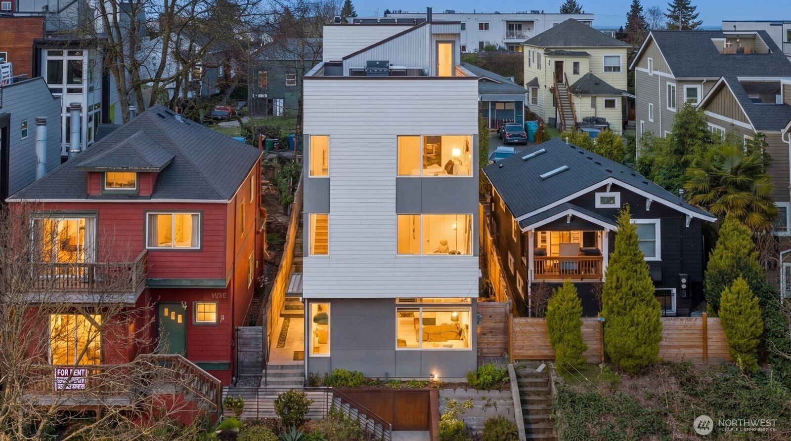 926 North 35th Street Seattle, WA 98103 - Photo 2 of 40 a front view of a residential apartment building with a yard