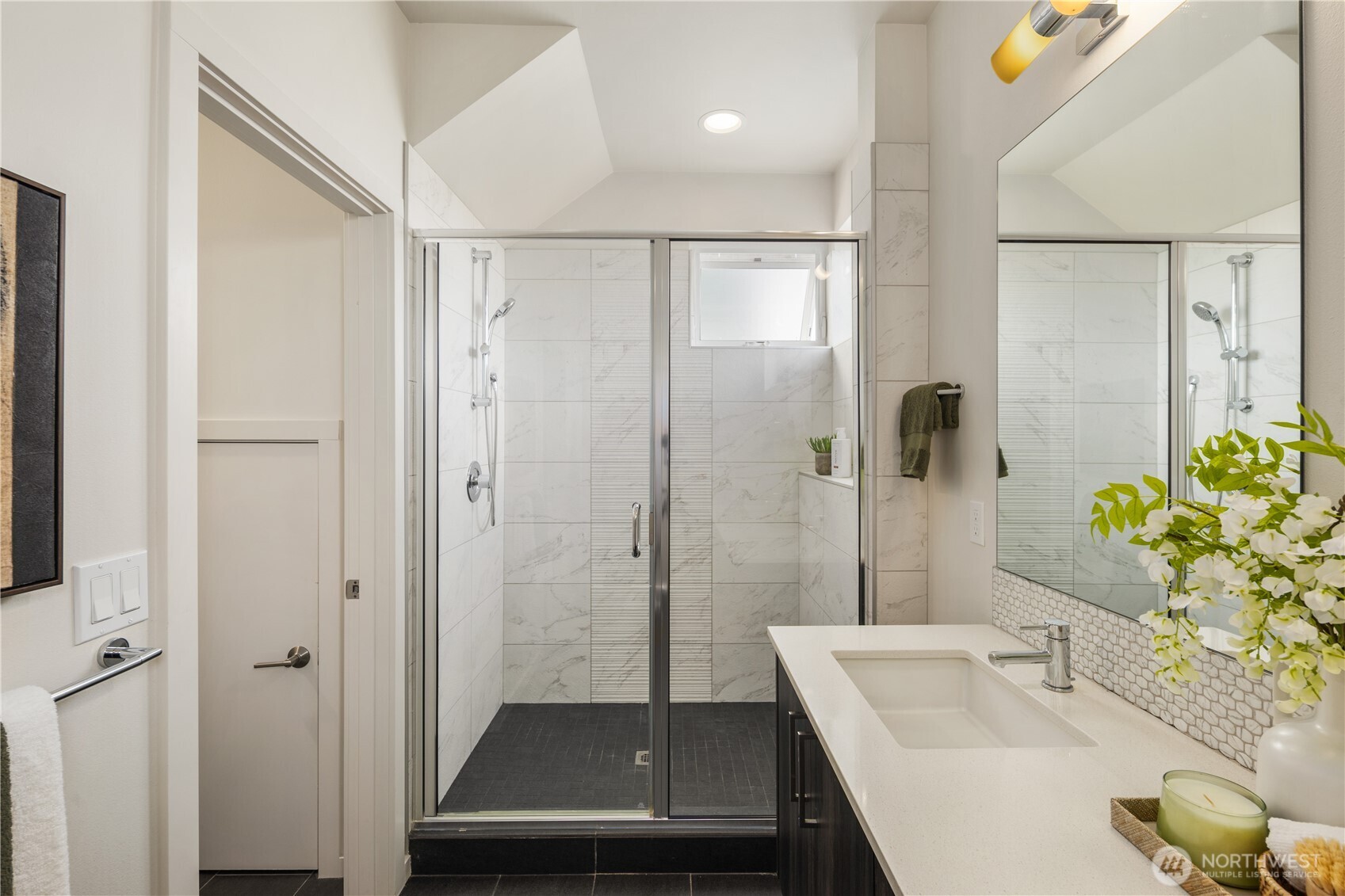 926 North 35th Street Seattle, WA 98103 - Photo 30 of 40 a bathroom with a sink and a shower