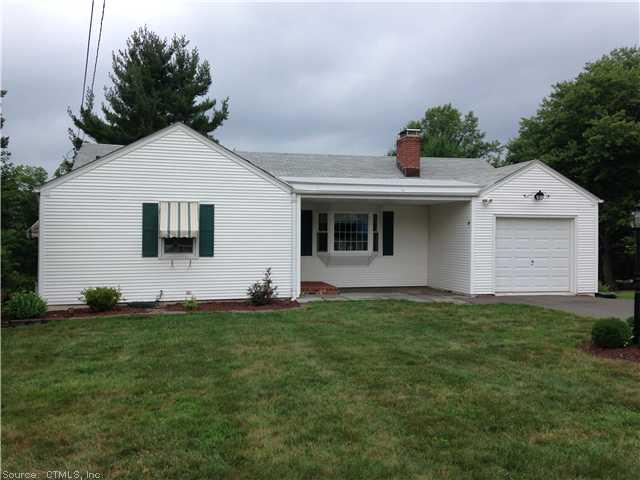21 Maple Ridge Drive Farmington, CT 06032 - Photo 1 of 1 a front view of a house with a yard