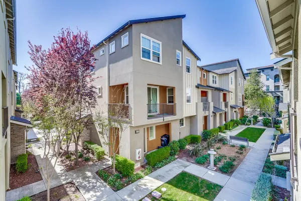 a view of a building with a yard