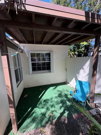 a backyard of a house with seating space