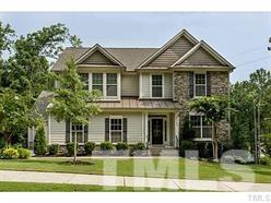 13028 Saxon Way Raleigh, NC 27613 - Photo 1 of 21 a front view of a house with a yard