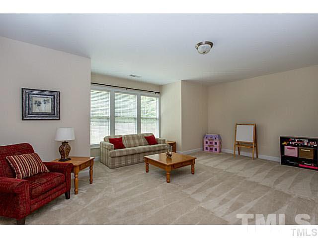 13028 Saxon Way Raleigh, NC 27613 - Photo 15 of 21 a living room with furniture and a window