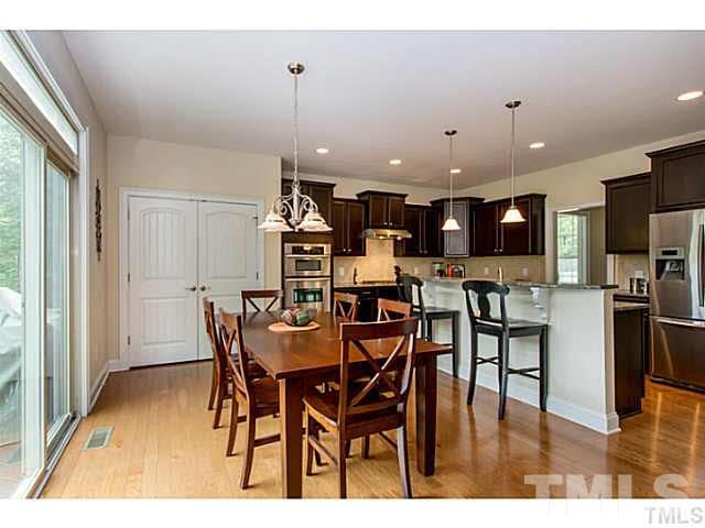 13028 Saxon Way Raleigh, NC 27613 - Photo 7 of 21 a view of a dining room with furniture