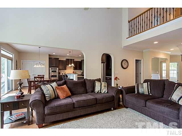 13028 Saxon Way Raleigh, NC 27613 - Photo 20 of 21 a living room with furniture and a large window