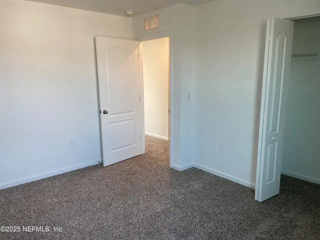 a white toilet and tub sitting next to a bathroom sink