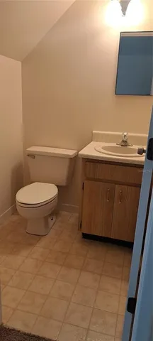 a bathroom with a toilet and a sink