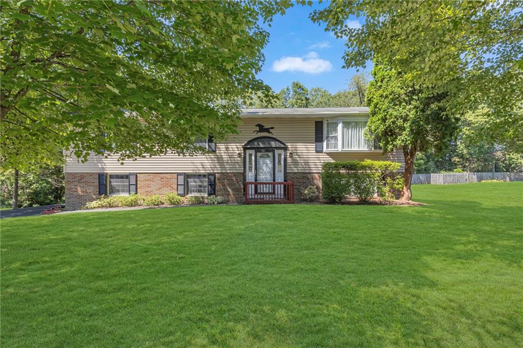 a front view of a house with a garden and porch