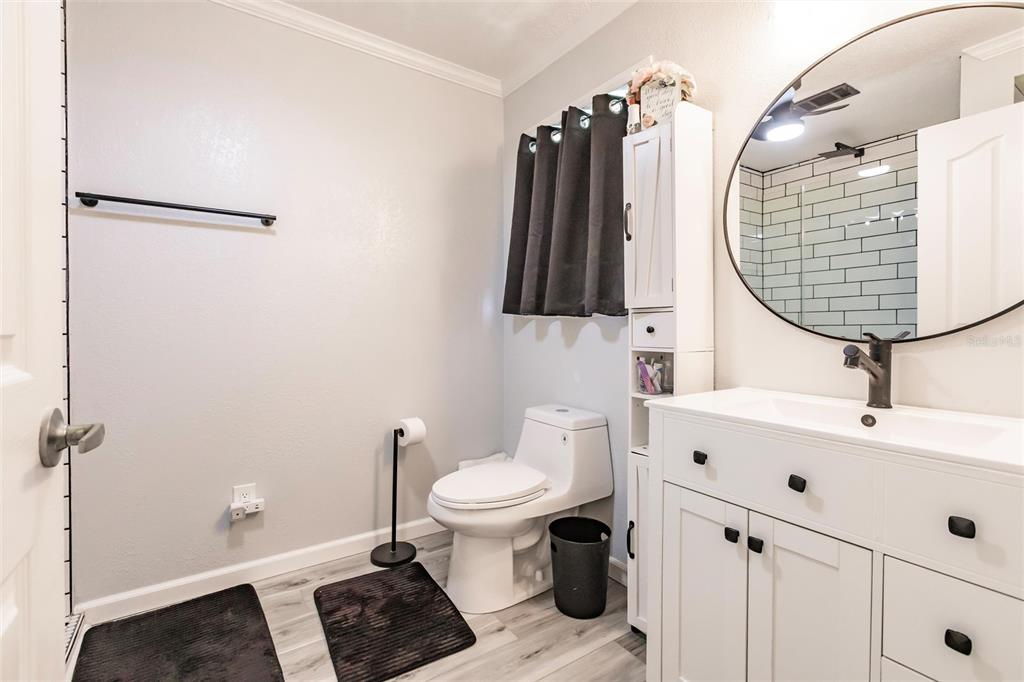 21 Rotterdam Punta Gorda, FL 33950 - Photo 11 of 40 a bathroom with a sink toilet and shower