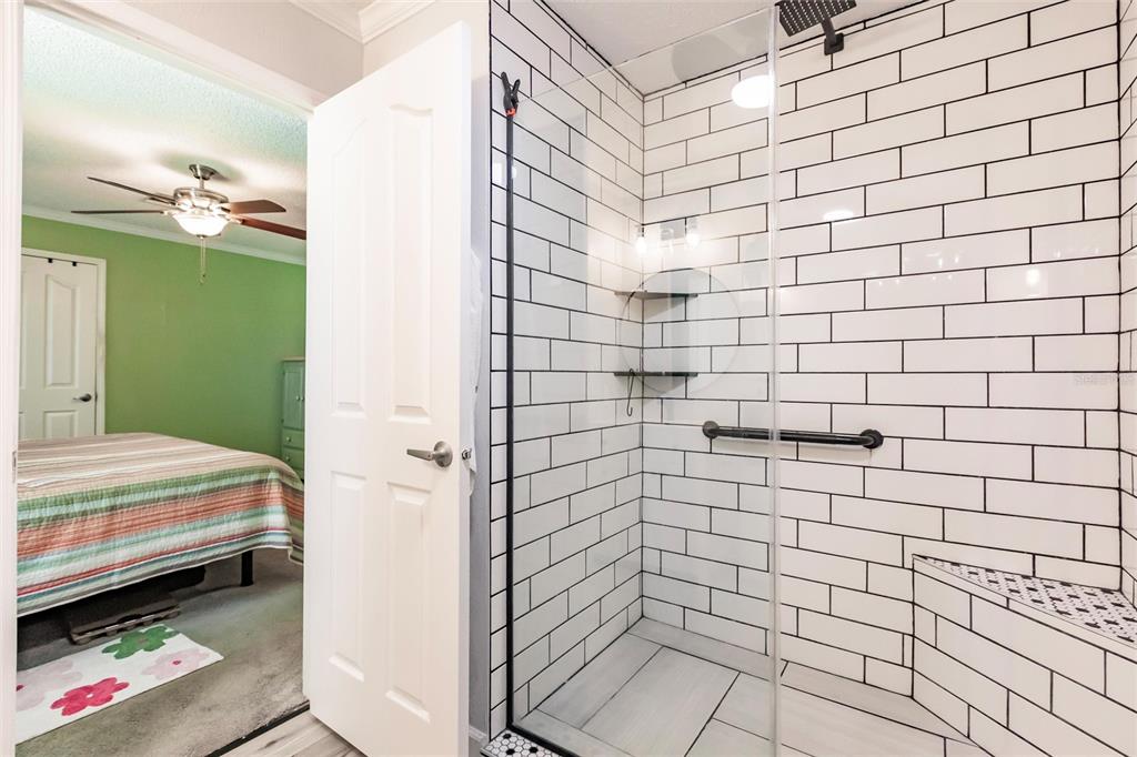 21 Rotterdam Punta Gorda, FL 33950 - Photo 12 of 40 a bathroom with a sink and a shower