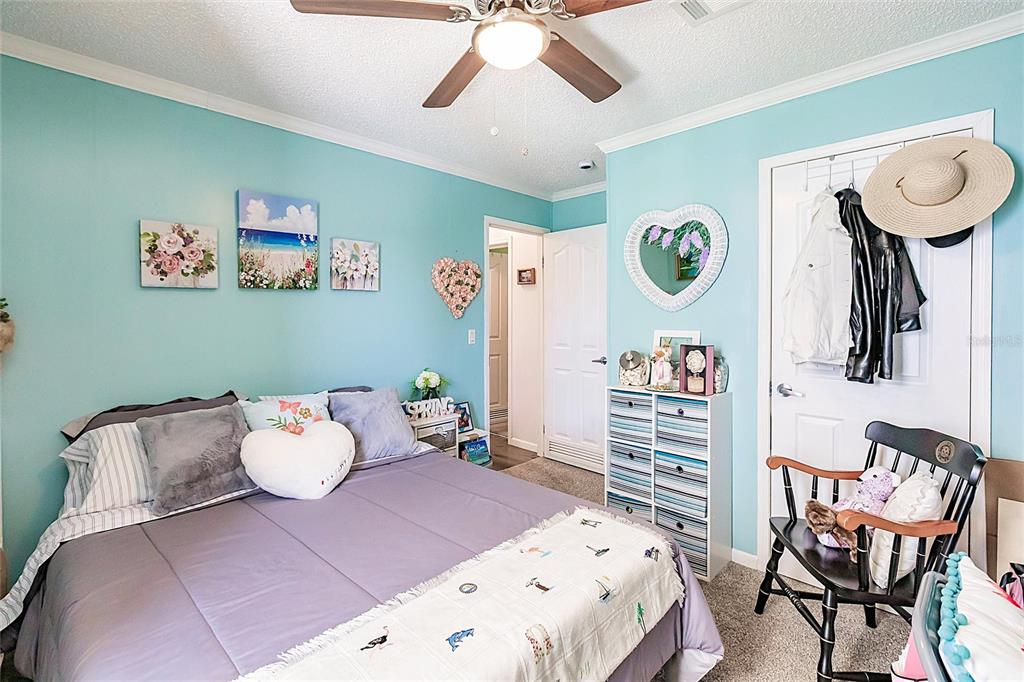 21 Rotterdam Punta Gorda, FL 33950 - Photo 14 of 40 a bedroom with a bed and furniture