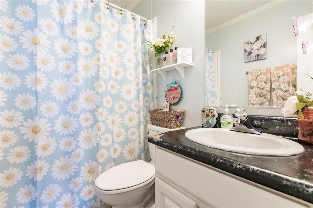 21 Rotterdam Punta Gorda, FL 33950 - Photo 15 of 40 a bathroom with a granite countertop sink and a mirror