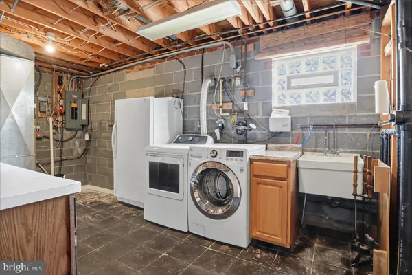 a utility room with dryer and washer