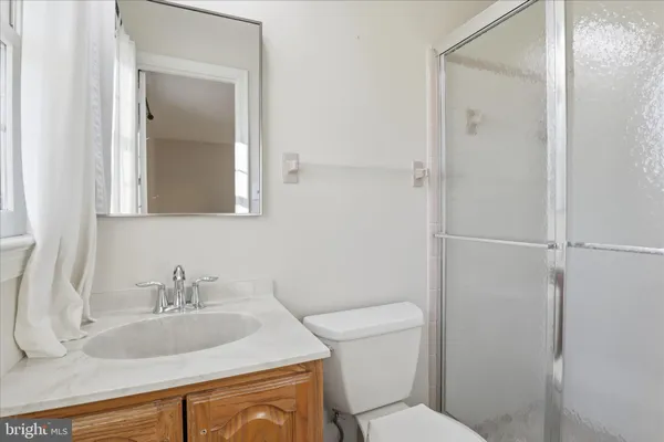 a bathroom with a sink toilet and vanity