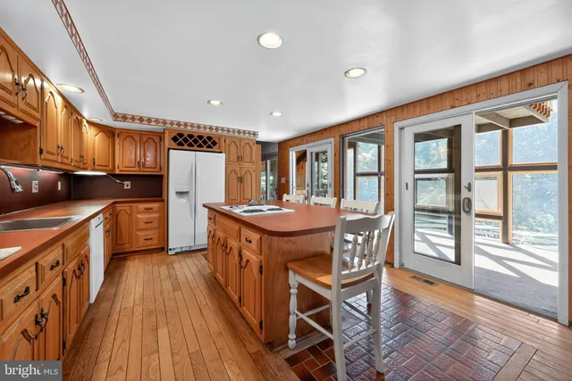 a bathroom with a granite countertop sink mirror and double