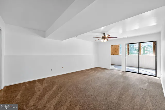 a view of an empty room with stairs