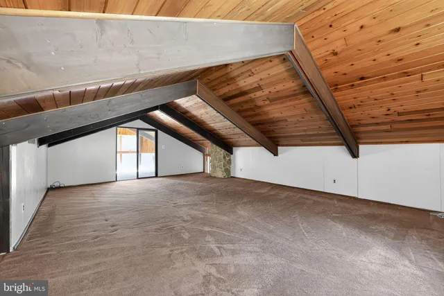 a view of storage and utility room with racks on the wall