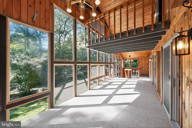 a view of a balcony with wooden floor and outdoor space
