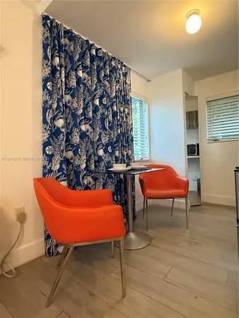 a room with furniture and a rug