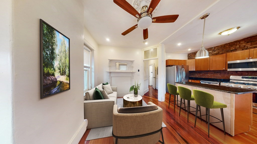 3 Mark Street, Unit 2 Boston, MA 02130 - Photo 1 of 1 a living room with furniture a flat screen tv and a large window